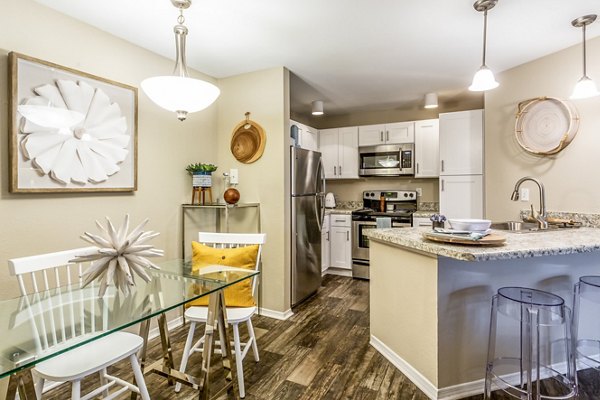 Dining area with modern decor and natural lighting at Fusion Apartments, a Greystar luxury property