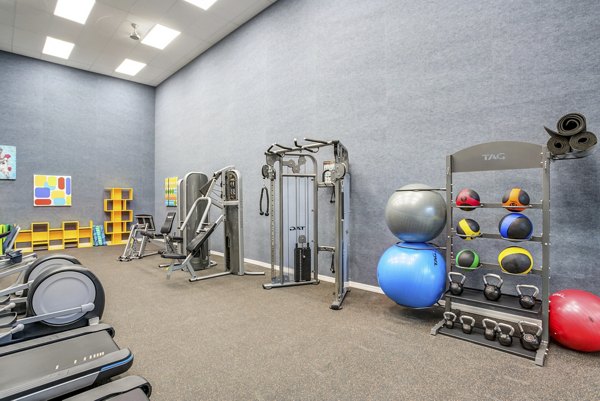 State-of-the-art fitness center with modern equipment at Fusion Apartments, perfect for active lifestyles and wellness-focused living