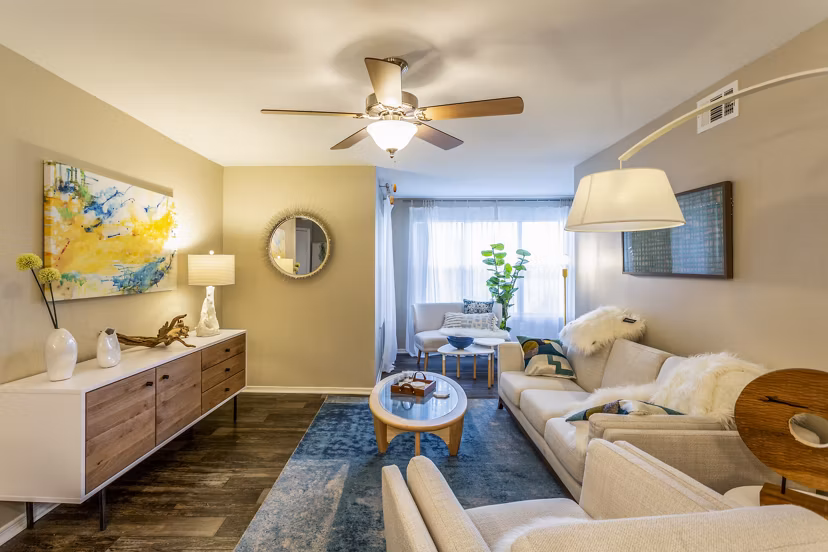 Spacious living room with modern decor at Fusion Apartments