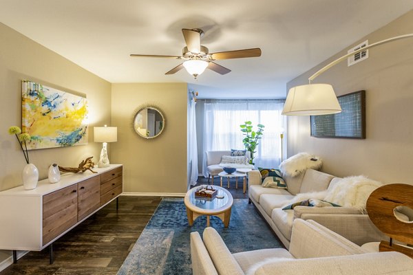 Spacious living room with modern decor at Fusion Apartments