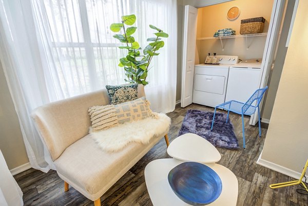 Modern living room with elegant furnishings at Fusion Apartments, luxury rental by Greystar