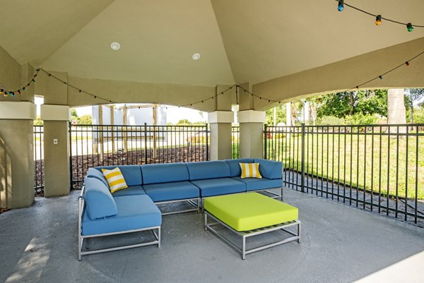 Expansive patio with modern seating at Fusion Apartments