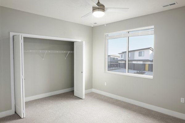 Cozy bedroom with modern furnishings at Allora 168 Apartments