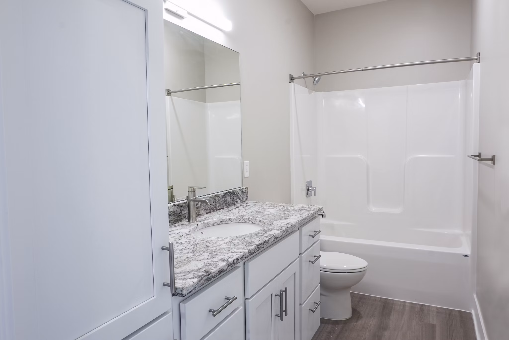 Modern bathroom featuring sleek fixtures and ample storage at Allora 168 Apartments, a Greystar luxury living community
