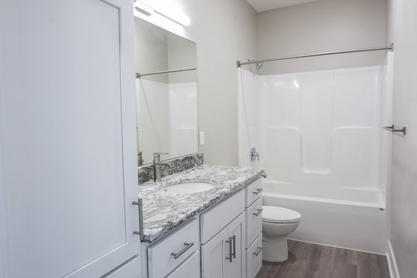 Modern bathroom featuring sleek fixtures and ample storage at Allora 168 Apartments, a Greystar luxury living community