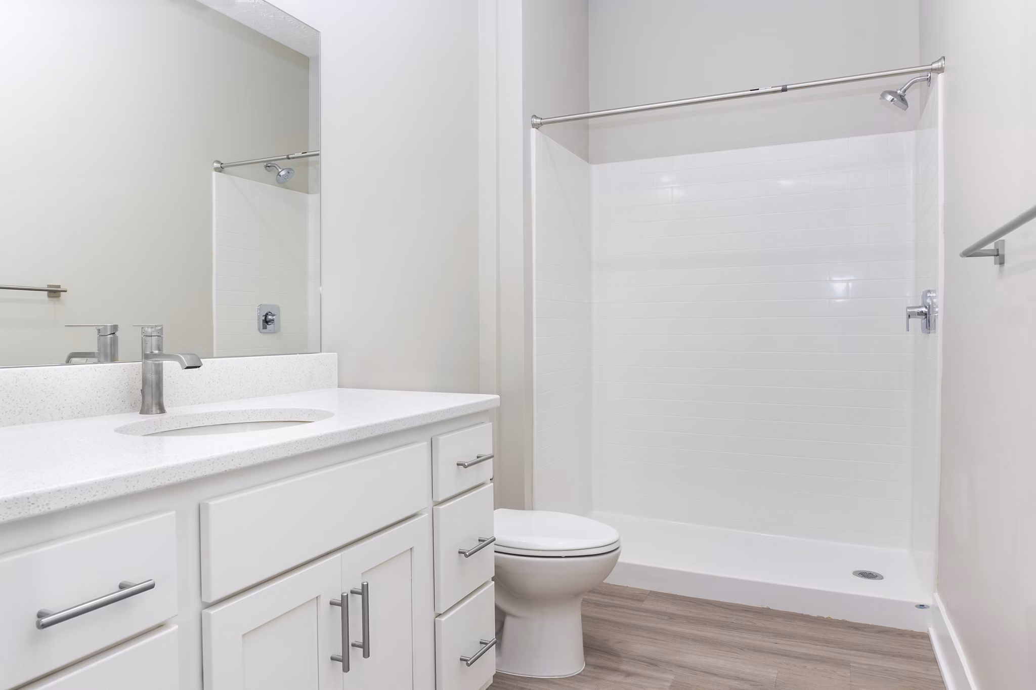 Modern bathroom with sleek fixtures featuring a stylish vanity and spacious shower at Allora 168 Apartments