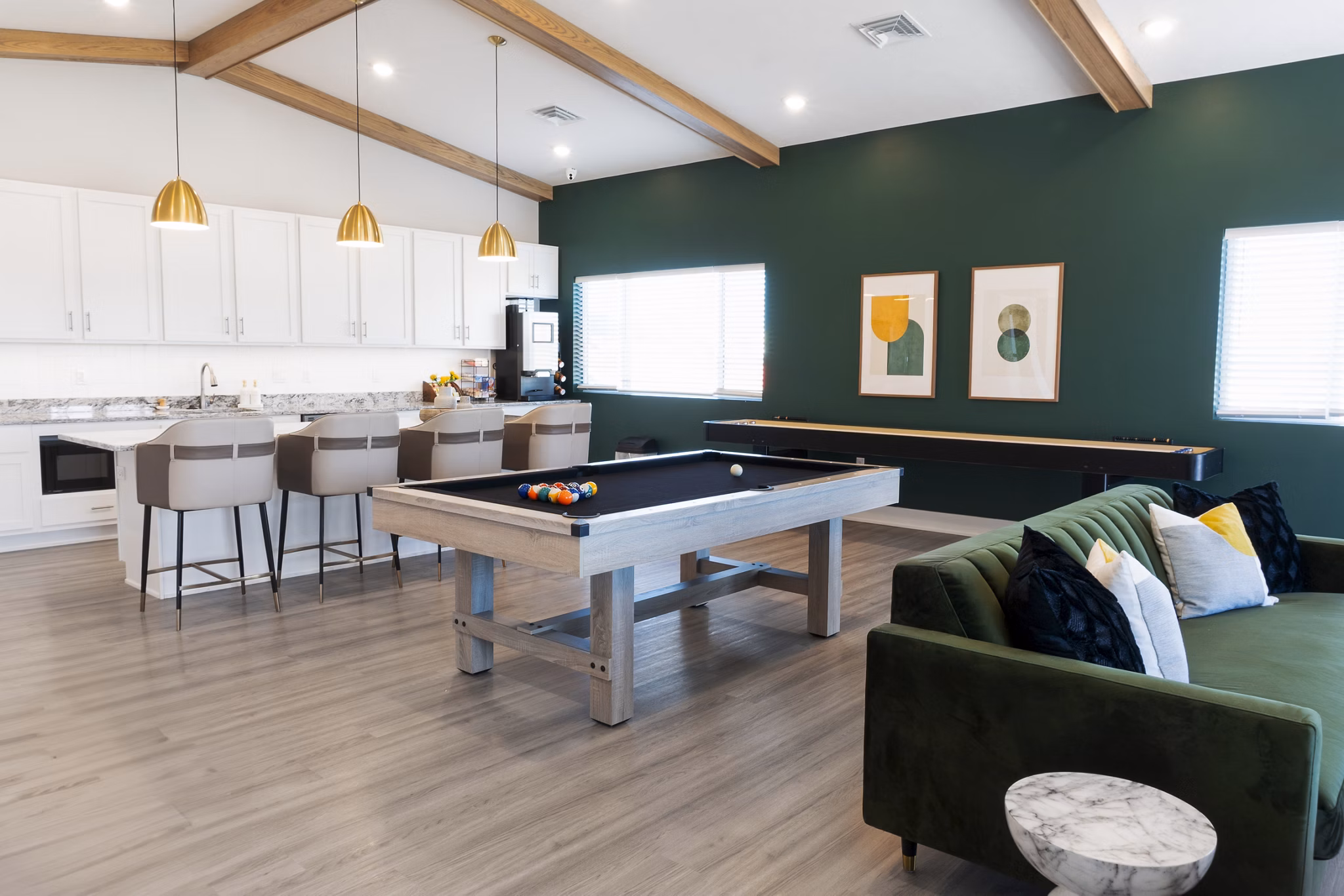 Clubhouse featuring game tables and seating at Allora 168 Apartments