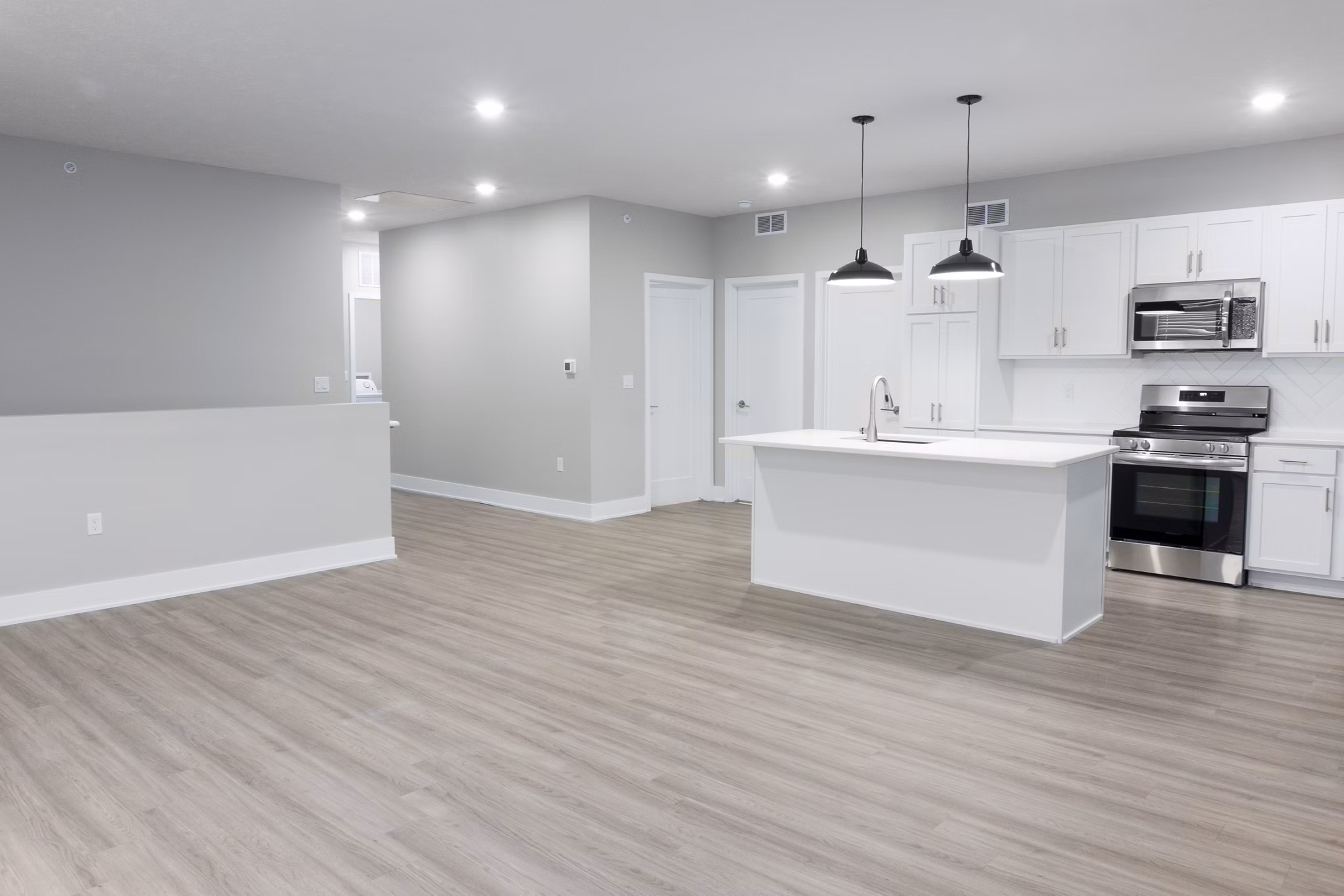 Dining room featuring modern furnishings and elegant lighting at Allora 168 Apartments, a luxury Greystar community
