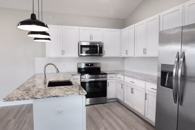 Modern kitchen with stainless steel appliances at Allora 168 Apartments