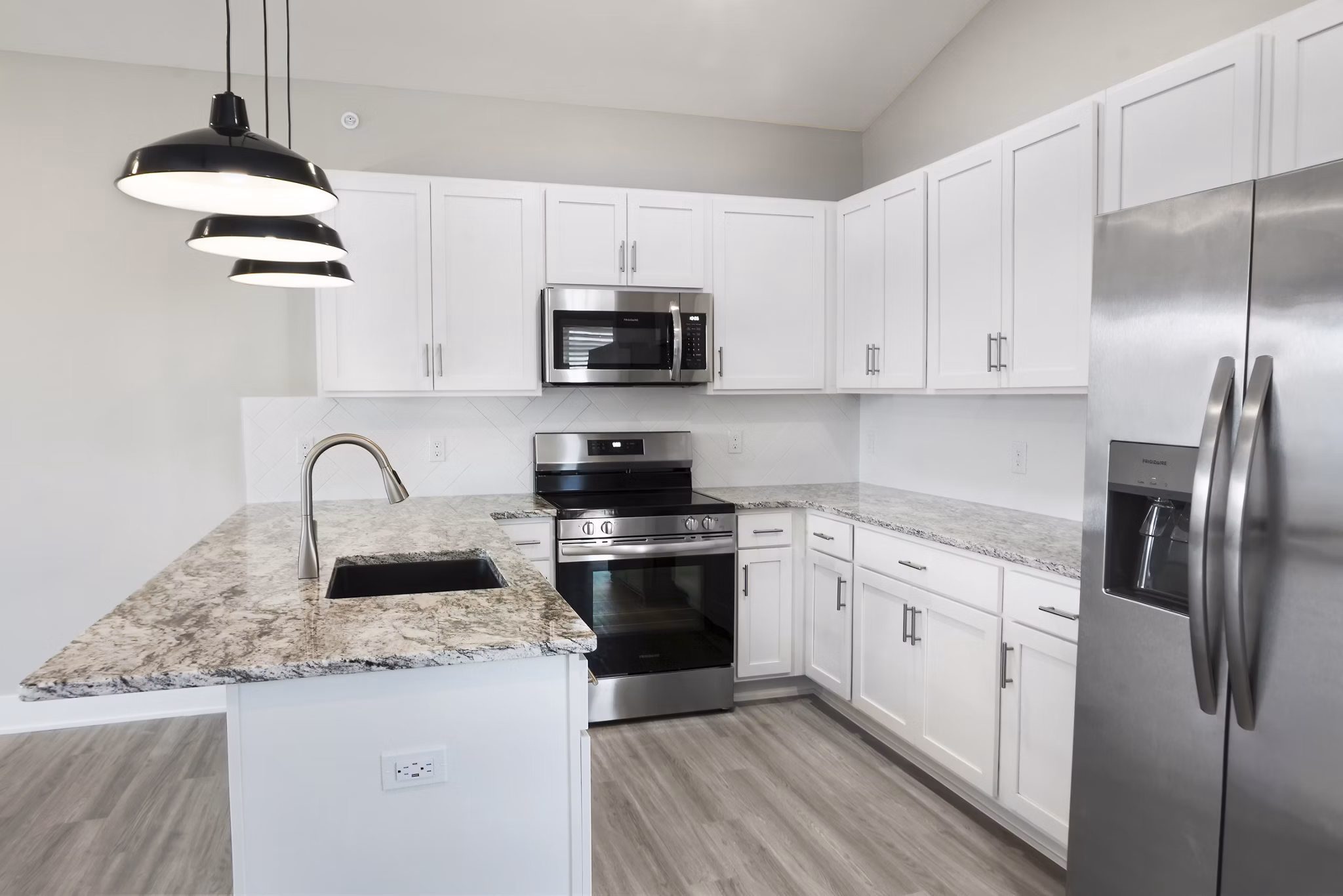Modern kitchen with stainless steel appliances at Allora 168 Apartments