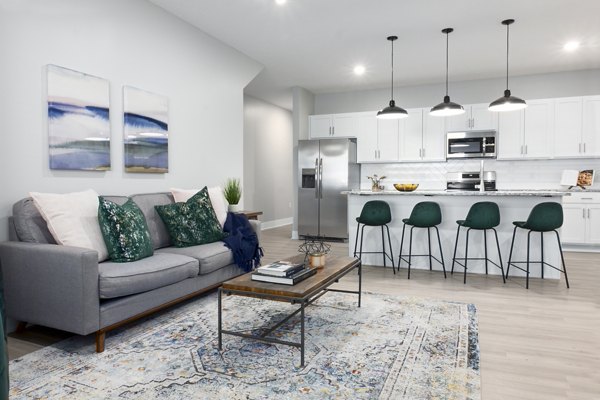 Spacious living room with modern decor in Allora 168 Apartments