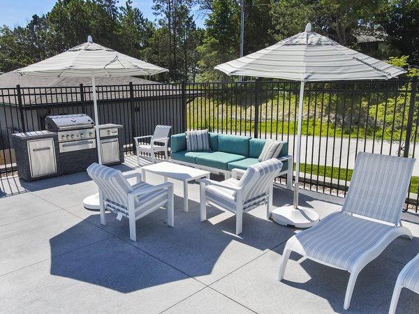 Outdoor grill area/patio at Allora 168 Apartments, perfect for entertaining and relaxation in a luxurious setting