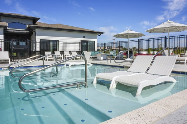 Luxurious poolside with sun loungers at Allora 168 Apartments