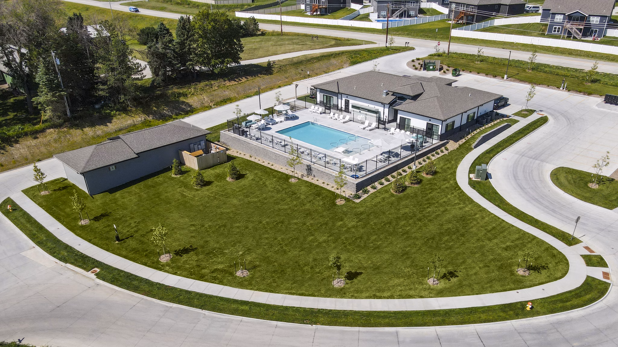 Rooftop pool with lounge chairs at Allora 168 luxury apartments
