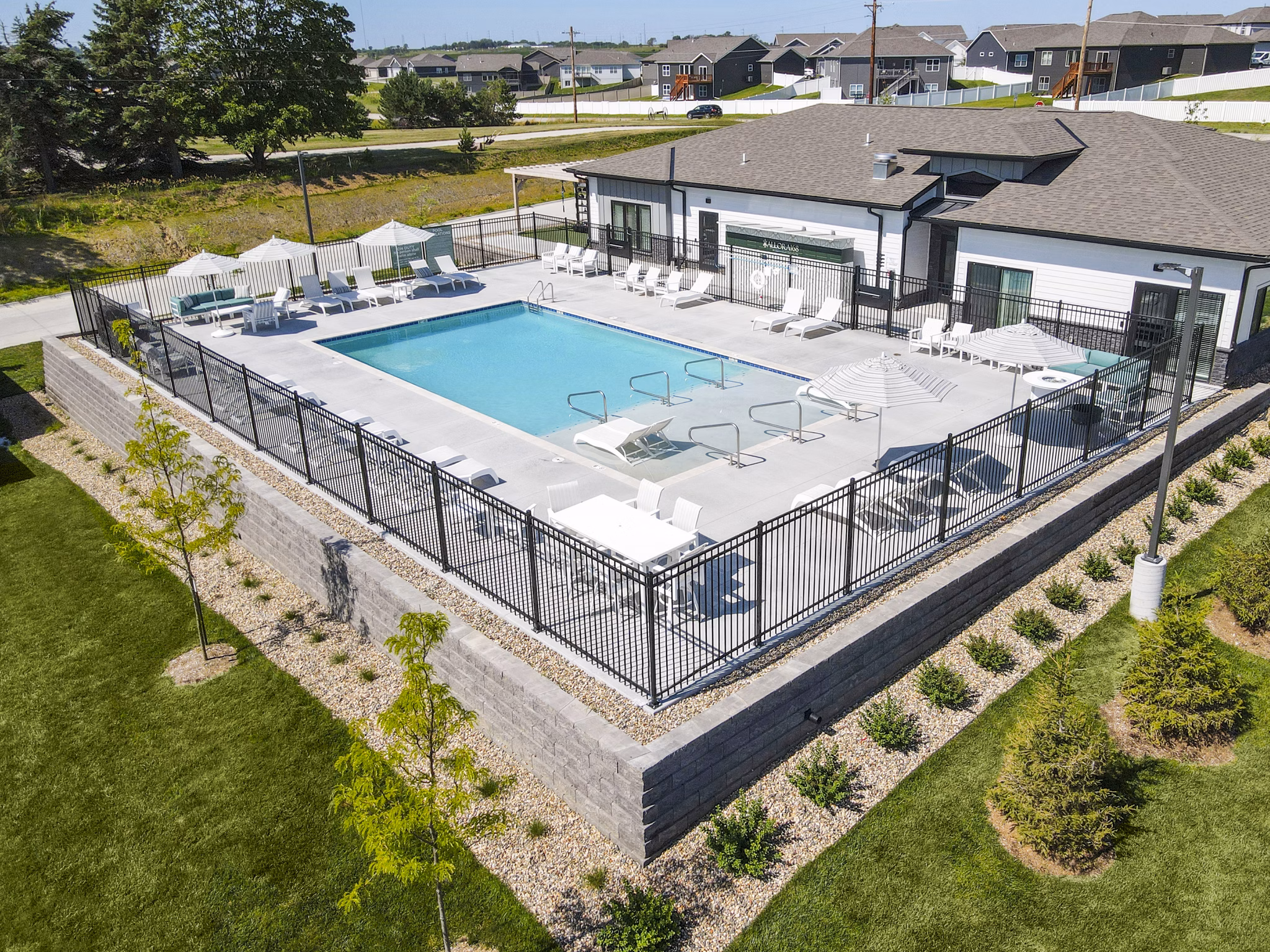 Inviting resort-style pool with lounging areas at Allora 168 Apartments