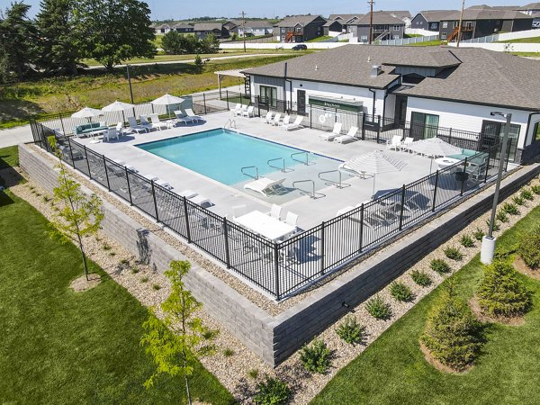 Inviting resort-style pool with lounging areas at Allora 168 Apartments