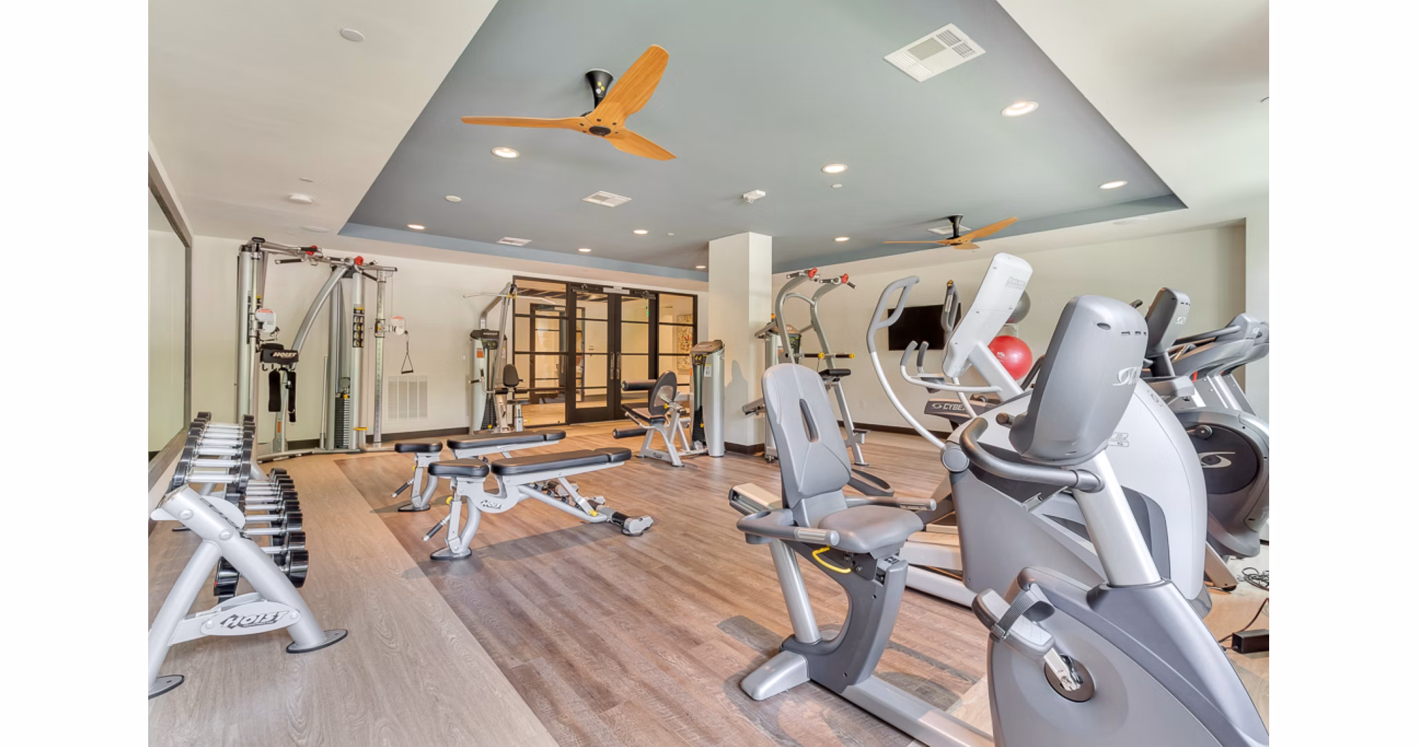 State-of-the-art fitness center at The Laurel Preston Hollow Apartments with modern equipment and spacious workout areas