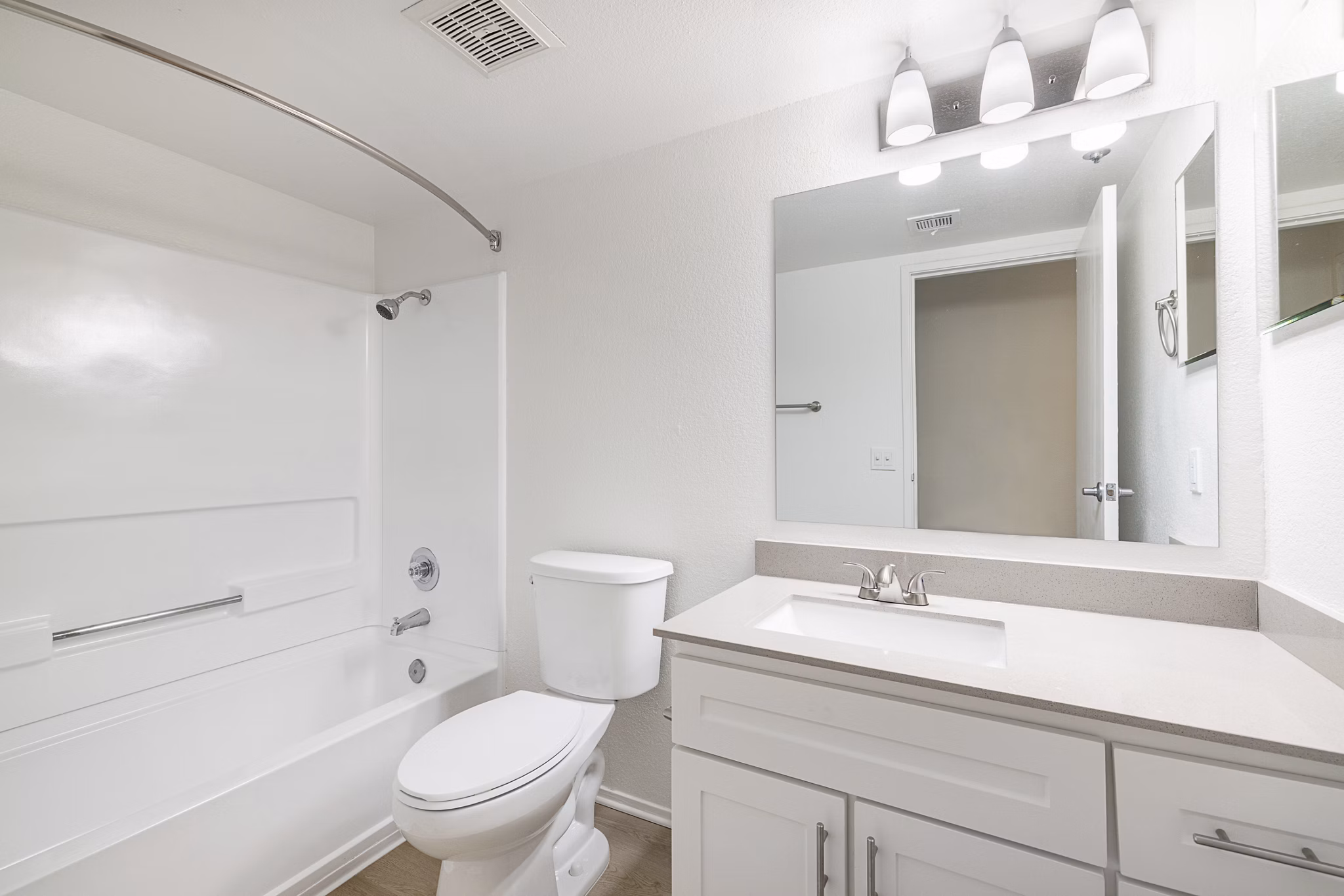 The Landing Apartments: Modern bathroom with sleek fixtures and ample lighting