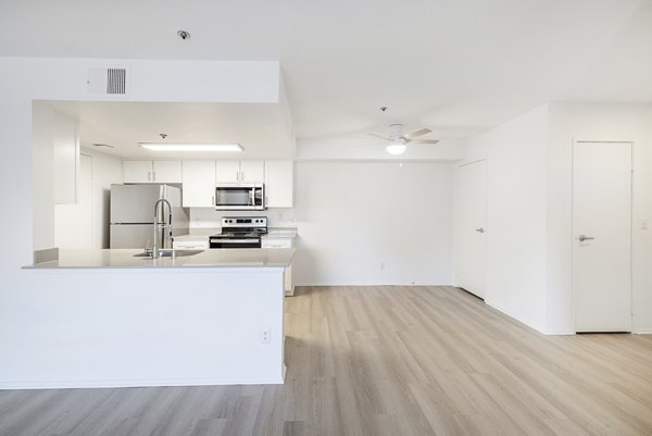 Sleek modern kitchen with stainless steel appliances at The Landing Apartments