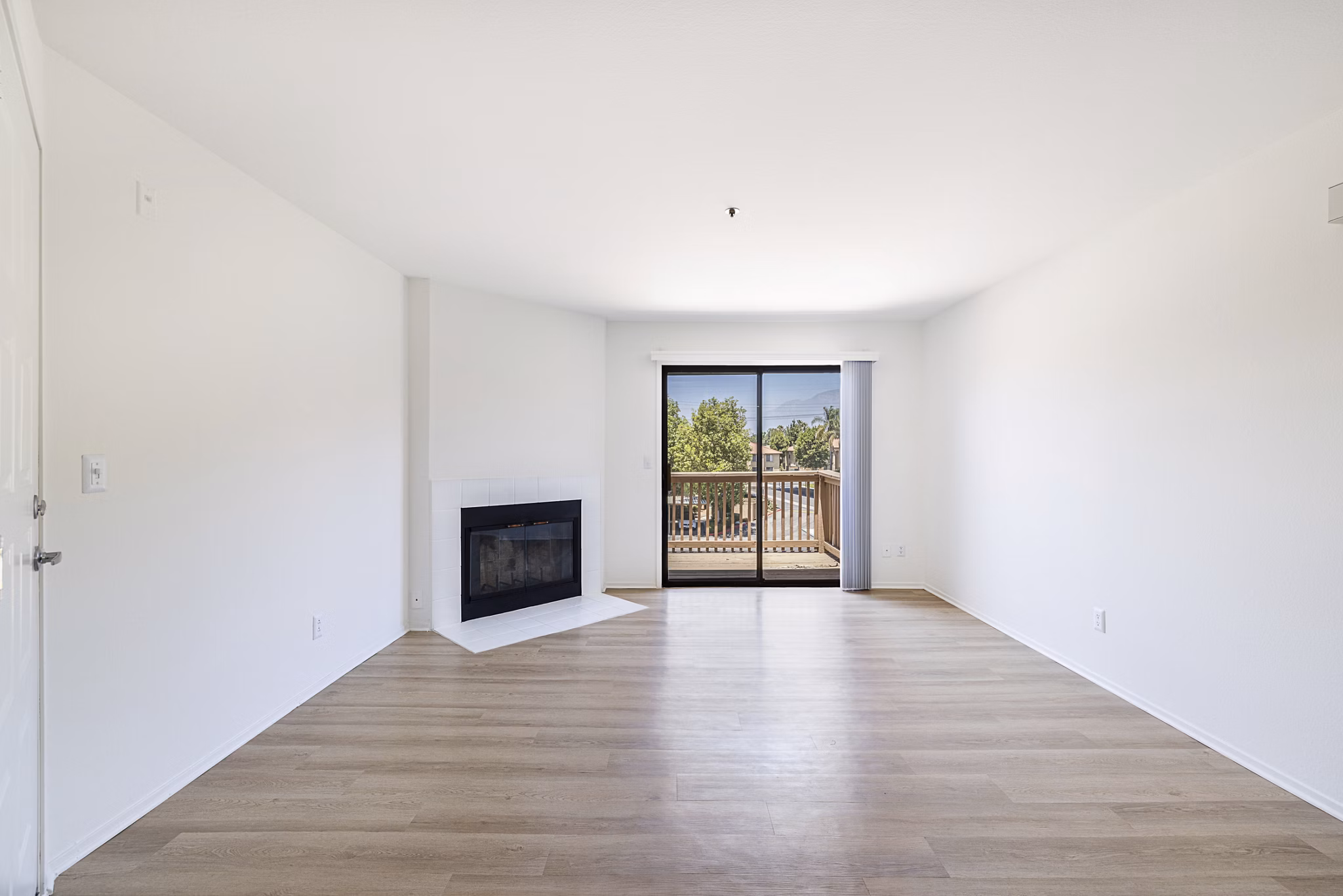 Spacious living room with modern decor at The Landing Apartments