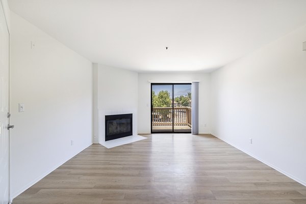 Spacious living room with modern decor at The Landing Apartments