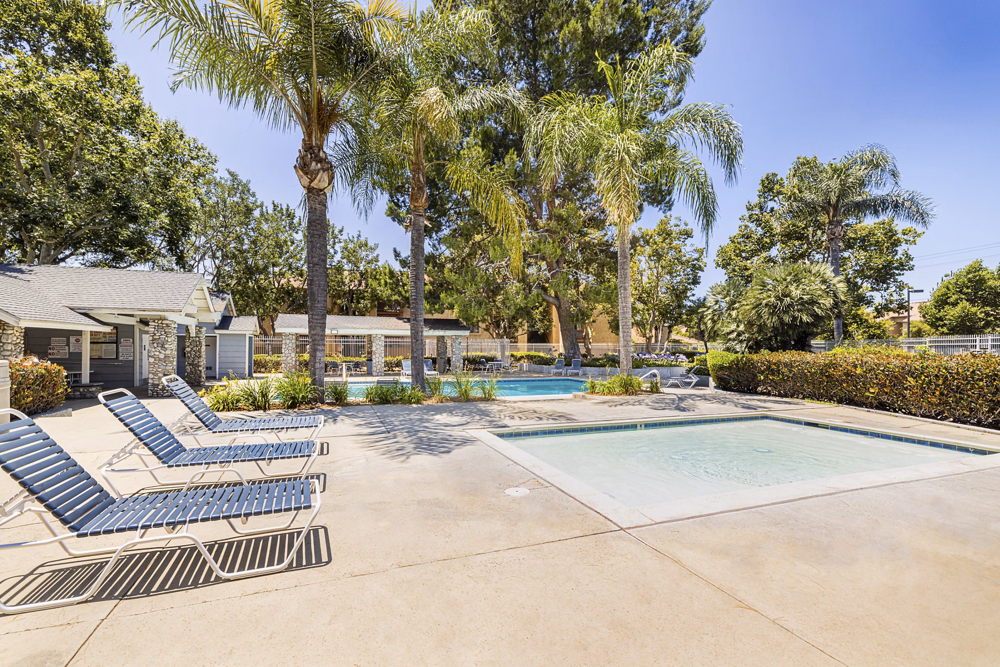Infinity-edge pool with cabanas at The Landing Apartments