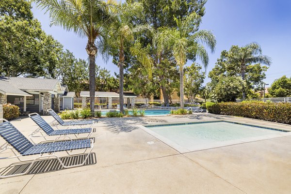 Infinity-edge pool with cabanas at The Landing Apartments