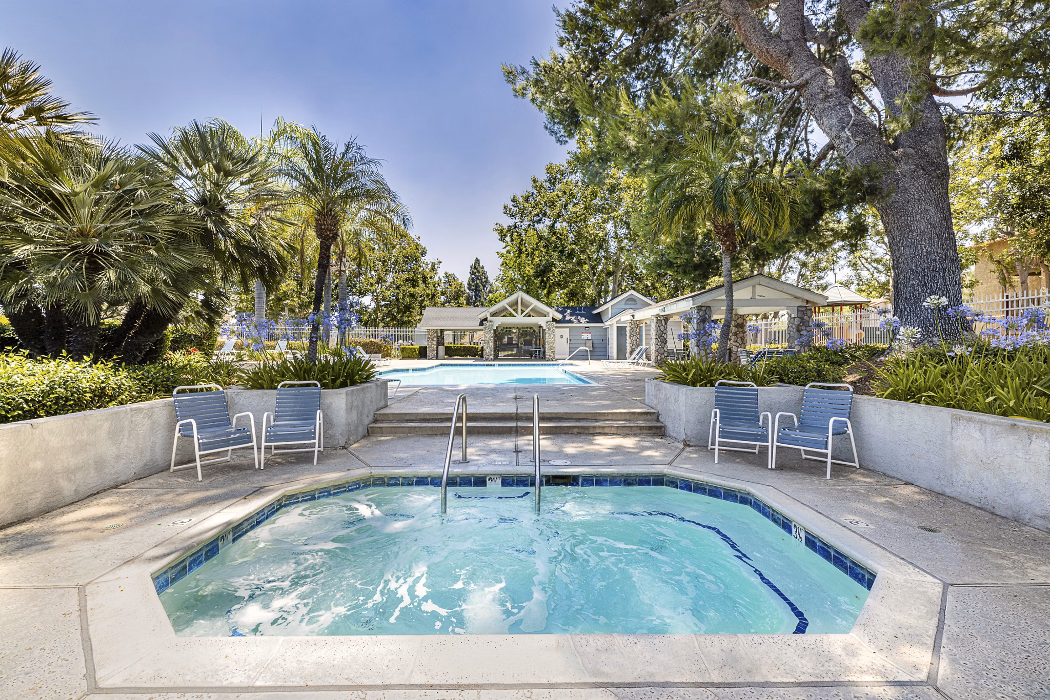 Hot tub with relaxing jets at The Landing Apartments, offering luxury amenities in a serene setting
