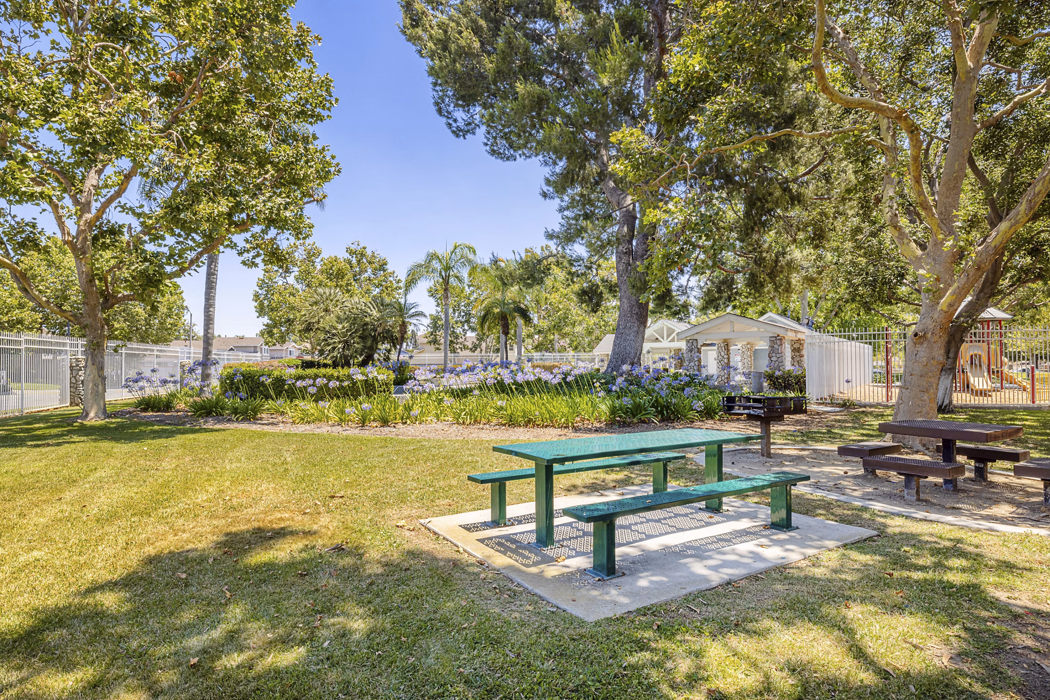 Courtyard featuring grill area and sport court at The Landing Apartments