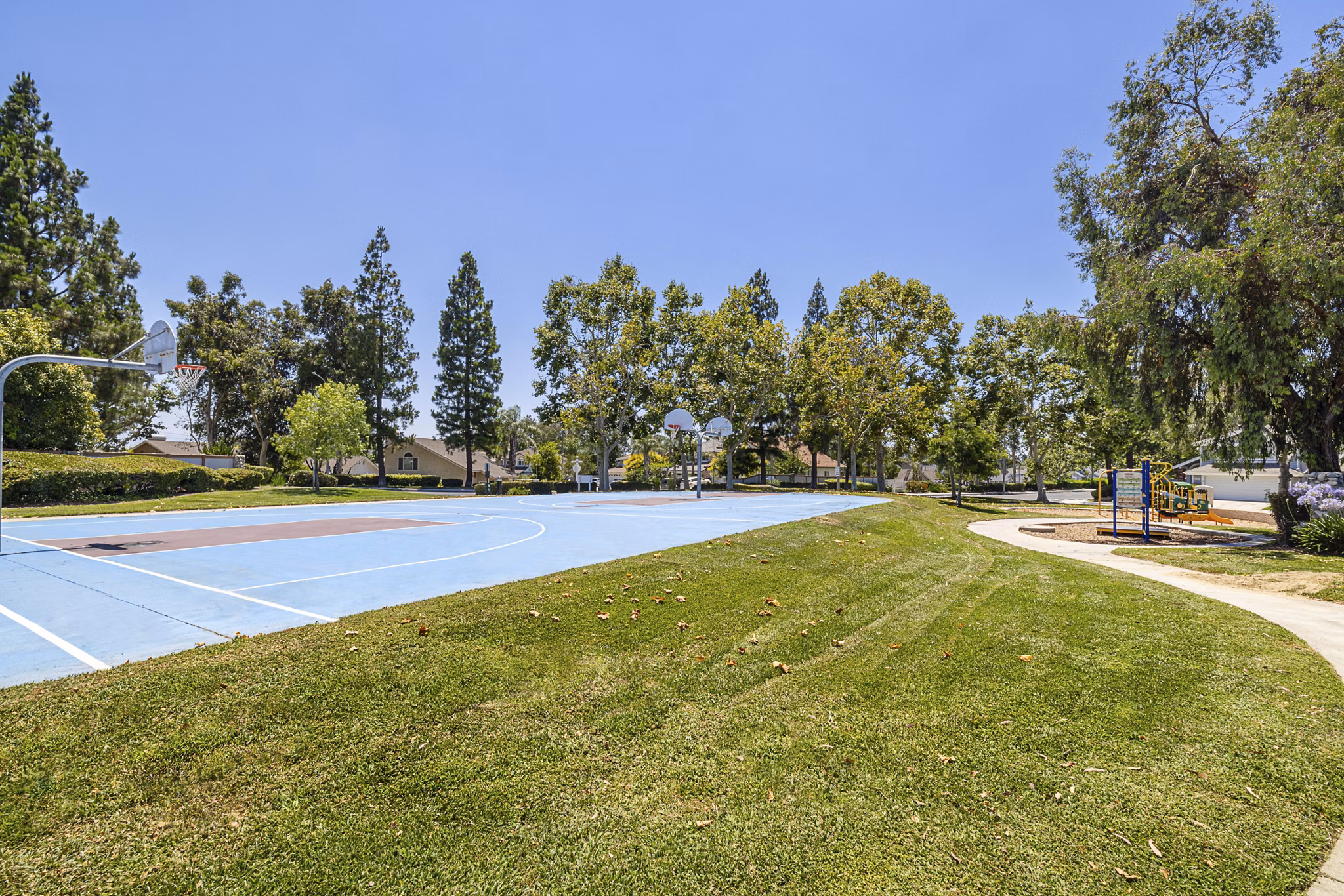 Sport court with basketball hoops at The Landing Apartments