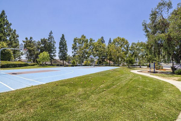Sport court with basketball hoops at The Landing Apartments