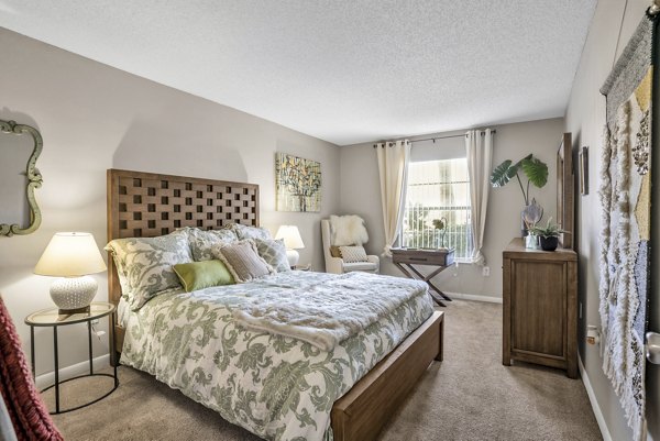 Comfortable bedroom with modern decor at Castilian Apartments