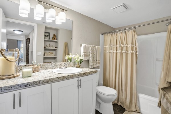 Modern bathroom featuring sleek fixtures and contemporary design at Castilian Apartments
