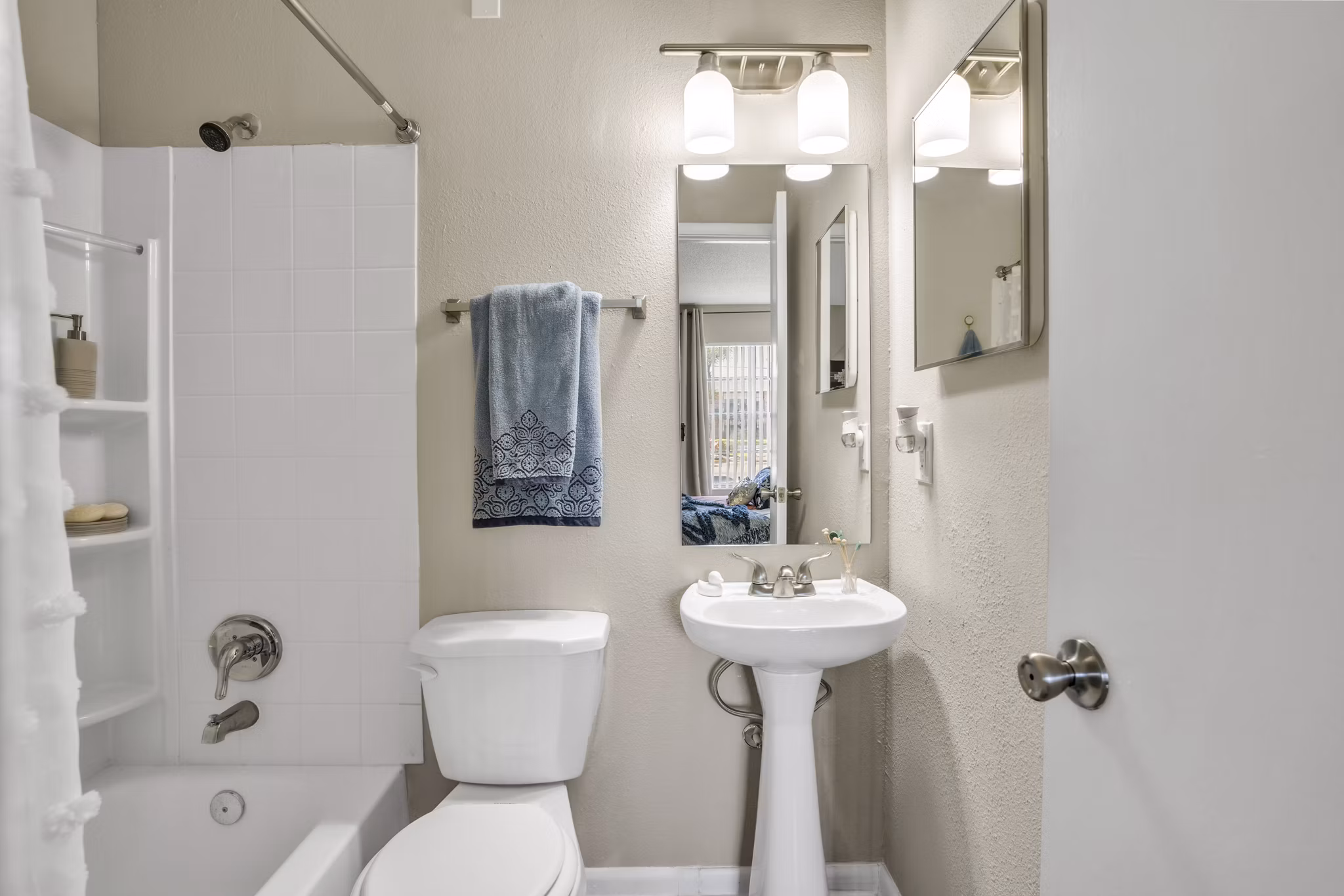 Modern bathroom with elegant fixtures at Castilian Apartments