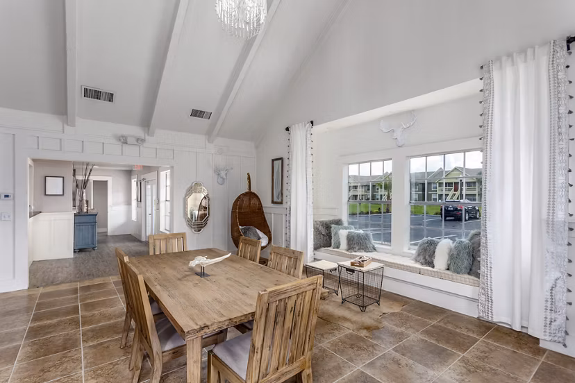 Stylish clubhouse featuring modern seating and entertainment area at Castilian Apartments