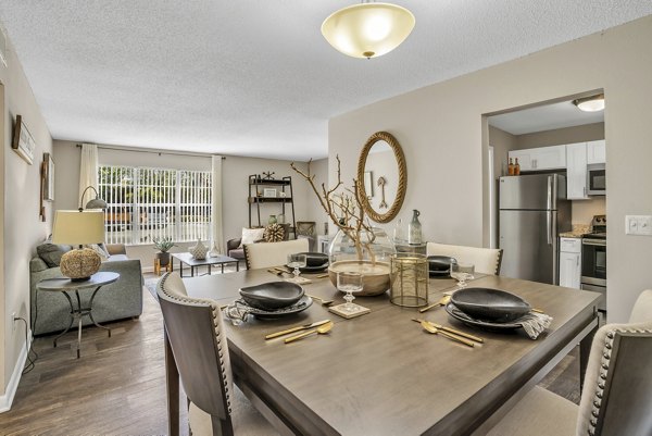 Dining area with modern decor and elegant lighting at Castilian Apartments