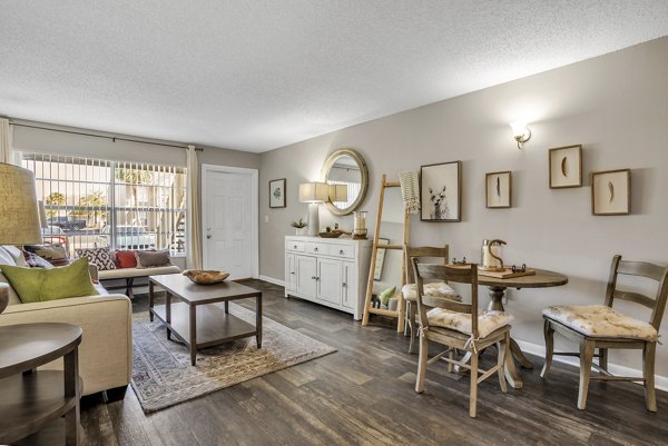 Dining area with modern lighting and elegant seating in Castilian Apartments, a luxury residence