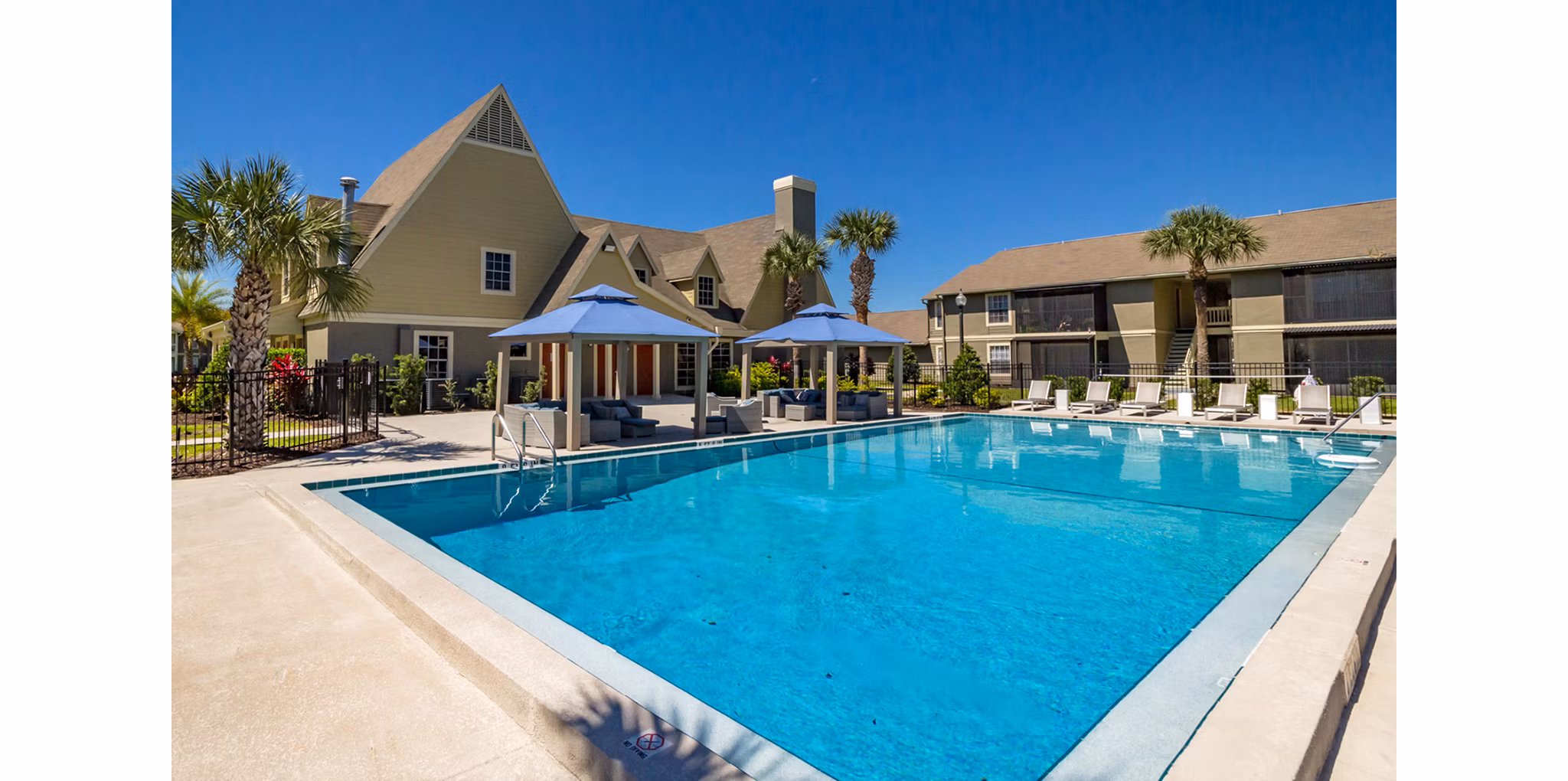 Outdoor pool with sundeck at Castilian Apartments, a luxury living community