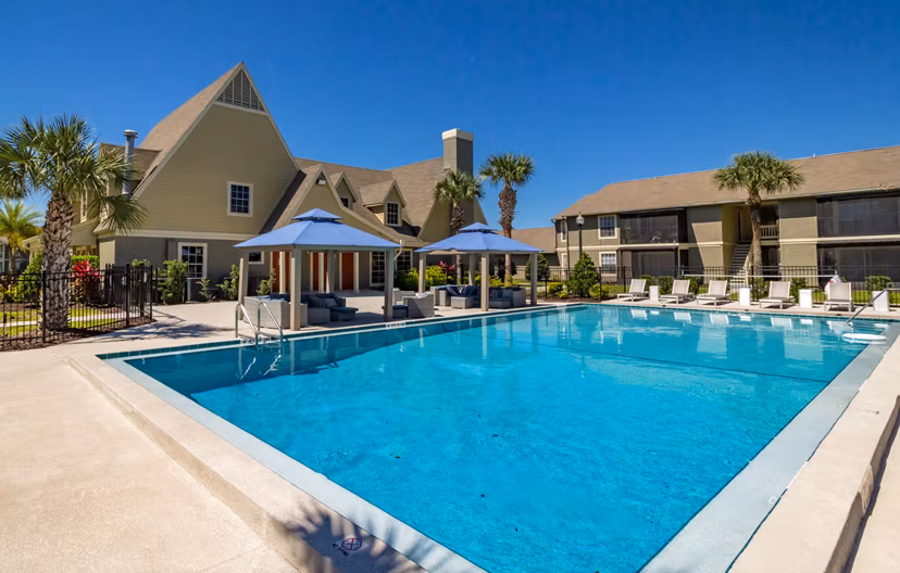 Outdoor pool with sundeck at Castilian Apartments, a luxury living community