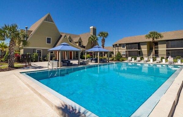 Outdoor pool with sundeck at Castilian Apartments, a luxury living community