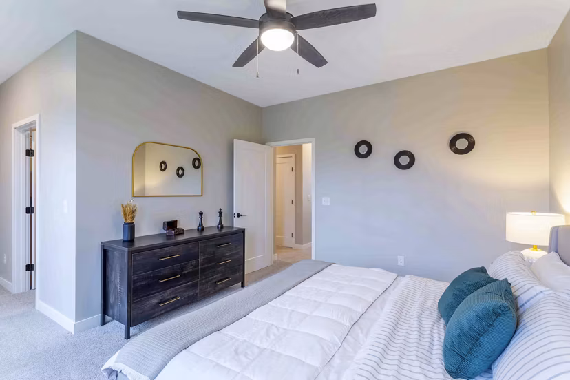 Cozy bedroom with modern decor at Summerwell Maple Grove Apartments