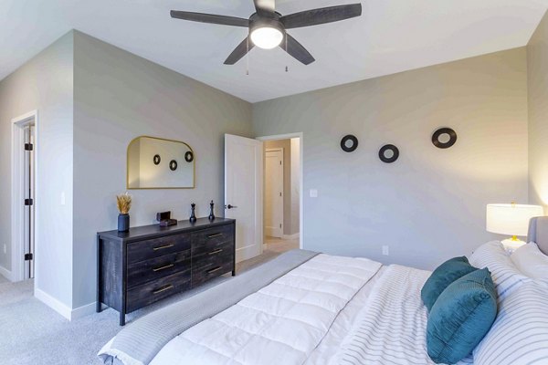Cozy bedroom with modern decor at Summerwell Maple Grove Apartments