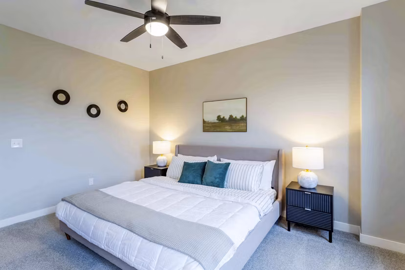 Bedroom featuring elegant decor and spacious layout in Summerwell Maple Grove Apartments