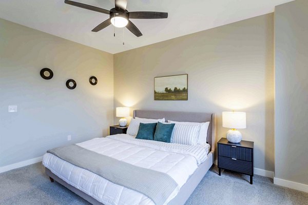 Bedroom featuring elegant decor and spacious layout in Summerwell Maple Grove Apartments