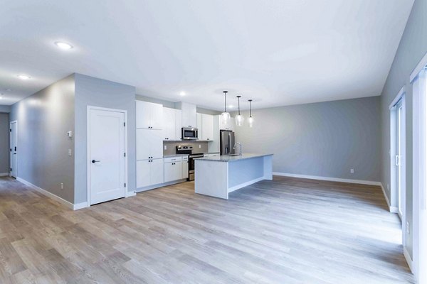 Dining room featuring elegant decor and natural light at Summerwell Maple Grove Apartments