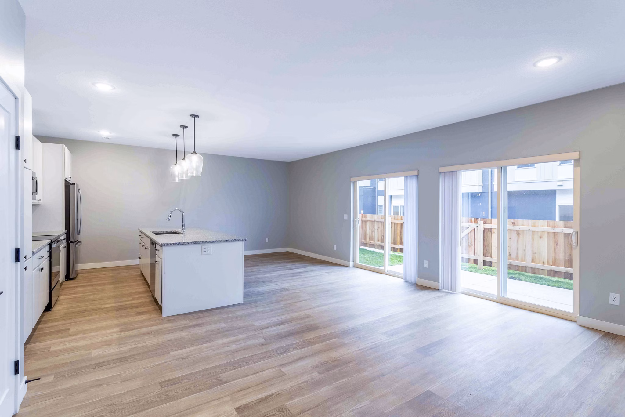 Spacious living room with modern decor at Summerwell Maple Grove Apartments
