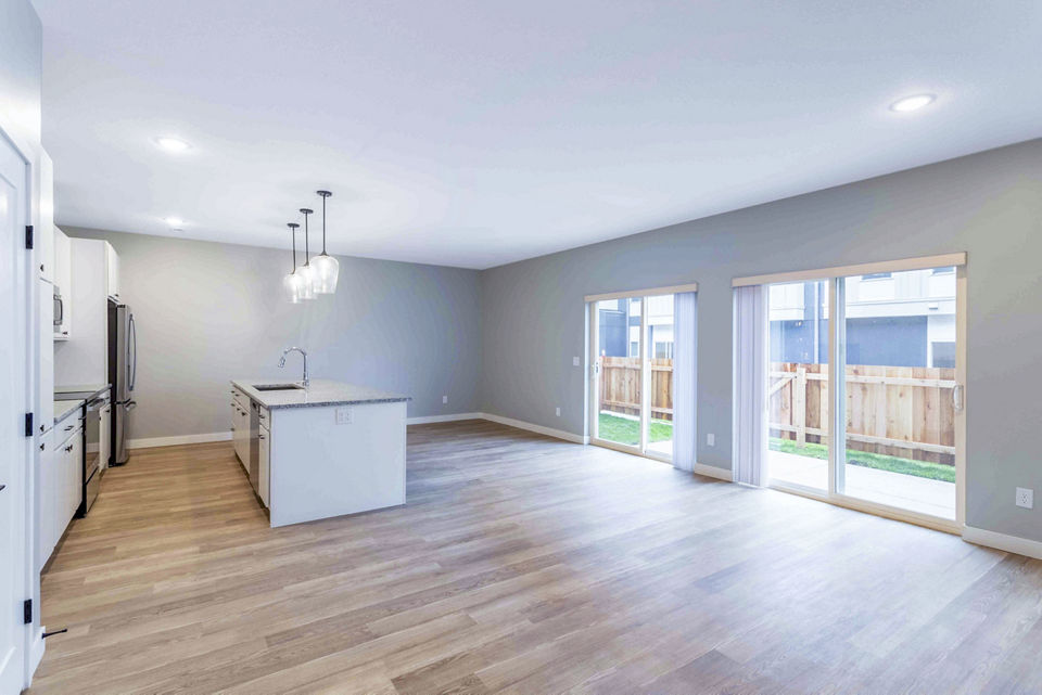Spacious living room with modern decor at Summerwell Maple Grove Apartments