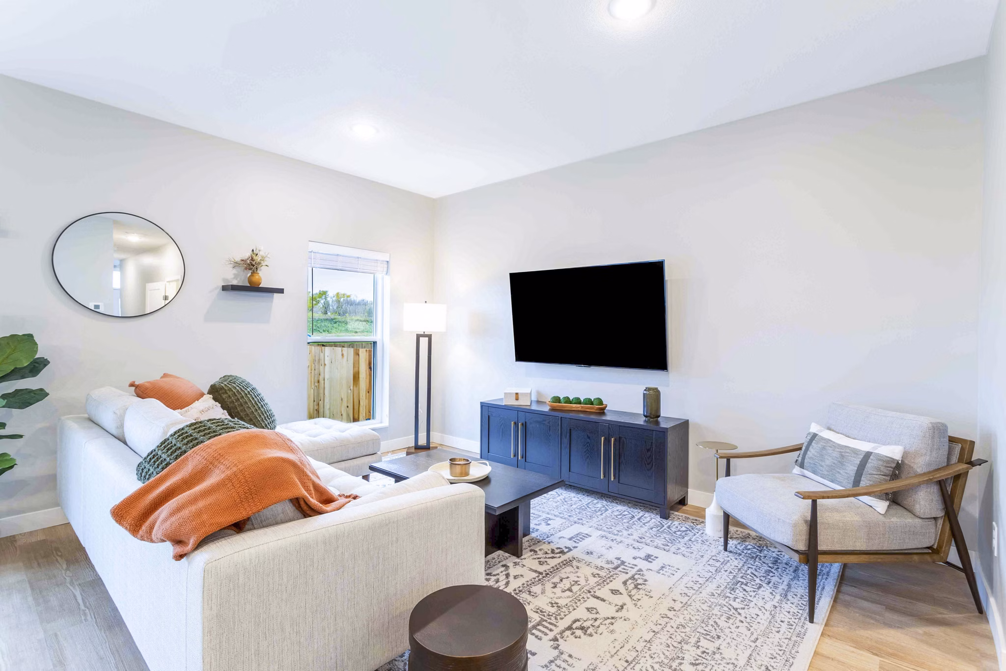 Living room with modern design and natural light at Summerwell Maple Grove Apartments