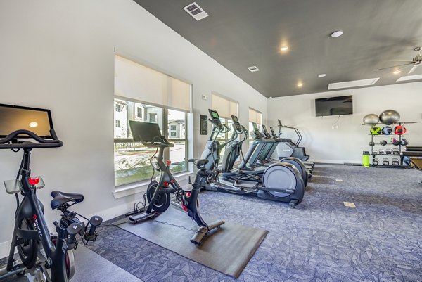 fitness center at Cascades at Onion Creek Apartments