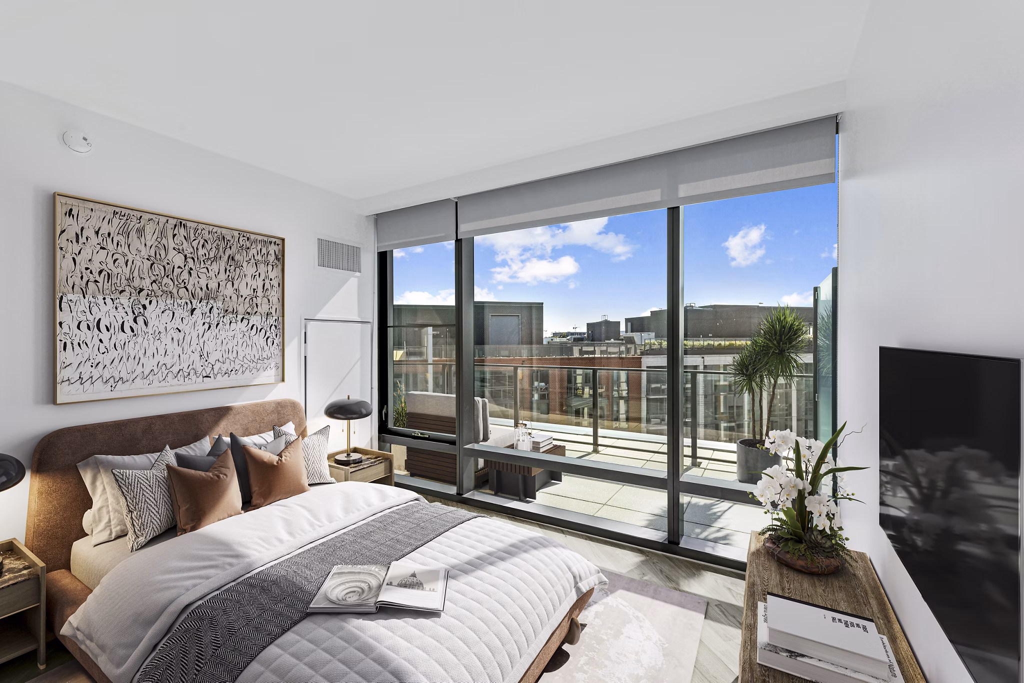 Elegant bedroom with modern decor at Crossing DC Apartments